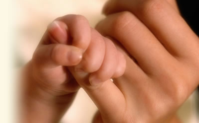 Baby grabbing Mothers Finger